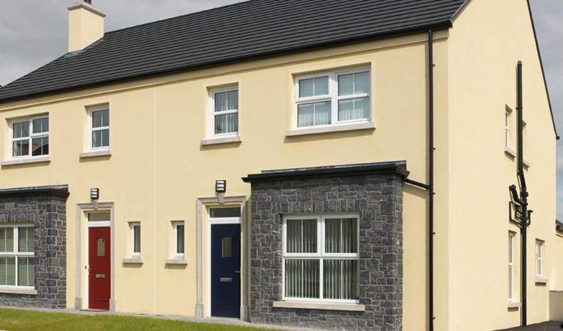 A house coated in a cream coloured silicon render.